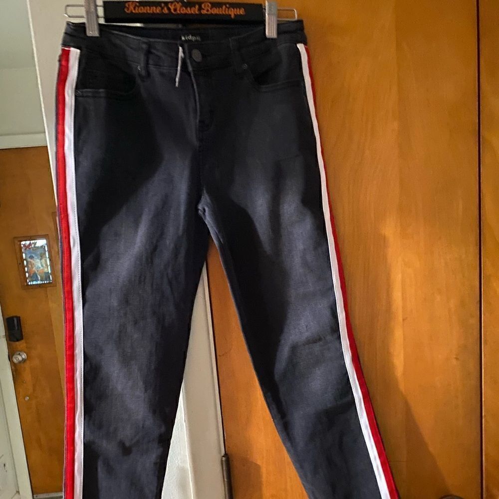 Girls black jeans with red and white stripe detail down the legs